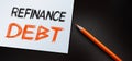 Orange pencil writes the words Refinance Debt. Business concept