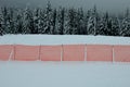 Orange perforated plastic PE foil barriers against snow in mountain areas. slow down the speed of snow, forming tongues and dune b