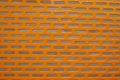 Orange perforated steel plate for background, Iron perforated sheet metal.