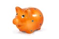 Orange piggy bank isolated on white