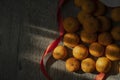 orange pile on the dark gray wood background decoration with red ribbon Royalty Free Stock Photo