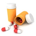 Orange pill bottle with cover spilling red medical pills Royalty Free Stock Photo