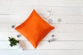 Orange Pillow case Mockup on white wooden background. Flat lay, top view photo mockup. Holidays decorations Royalty Free Stock Photo
