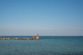 An orange pilot boat goes to the outer roadstead to ensure the escort of the vessel to the port. Royalty Free Stock Photo