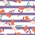Orange and pink random ditsy flowers print seamless pattern. Purple and white striped background Royalty Free Stock Photo