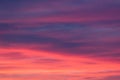 Orange and pink sunset sky with cirrus clouds Royalty Free Stock Photo