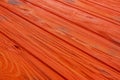 Orange plank wood texture background. Close up of painted wooden fence panels Royalty Free Stock Photo