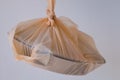 Orange plastic bag Tightly tied For safety and protection against foreign objects Into food additives Contained within