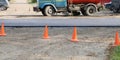 Orange plastic cones blocking the passage to the section of the road where repair work