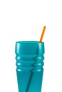 Orange plastic drinking straws in the blue cup on white background with clipping path. Royalty Free Stock Photo