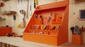 Orange plastic toolbox organizing tools on workbench in workshop Royalty Free Stock Photo