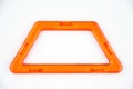 Orange plastic trapezoid from transparent constructor kit (puzzle builder for kids)