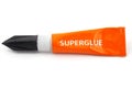 Orange plastic tube labeled superglue