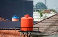 Orange plastic water storage tank tower Royalty Free Stock Photo