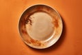 An orange plate with a dirty plate on it AI generation