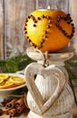 Orange pomander ball with candle. Christmas decorations Royalty Free Stock Photo