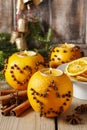 Orange pomander ball with candle. Christmas decorations Royalty Free Stock Photo