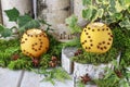 Orange pomander ball with candle on wooden table Royalty Free Stock Photo