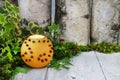 Orange pomander ball with candle on wooden table Royalty Free Stock Photo