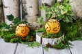 Orange pomander ball with candle on wooden table Royalty Free Stock Photo