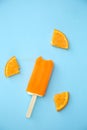 Popsicle with fresh orange on a table Royalty Free Stock Photo