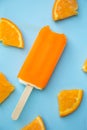 Popsicle with fresh orange on a table Royalty Free Stock Photo