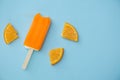 Popsicle with fresh orange on a table Royalty Free Stock Photo