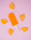 Popsicle with fresh orange on a table Royalty Free Stock Photo