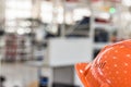 Safety helmet against industrial background