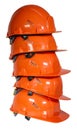 Orange protective helmet on a white background. Construction helmet. A stack of several helmets