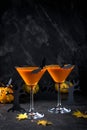Orange pumpkin, Halloween drink for party and holiday decorations over black background. copy space Royalty Free Stock Photo