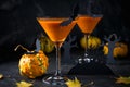 Orange pumpkin, Halloween drink for party and holiday decorations over black background  with copy space Royalty Free Stock Photo