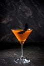 Orange pumpkin martini Halloween drink for party over black background. copy space Royalty Free Stock Photo