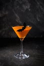 Orange pumpkin  martini Halloween drink for party over black background  with copy space Royalty Free Stock Photo