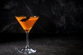 Orange pumpkin martini Halloween drink for party over black background. Copy space Royalty Free Stock Photo