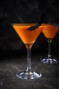 Orange pumpkin  martini Halloween drink for party over black background  with copy space Royalty Free Stock Photo