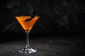 Orange pumpkin  martini Halloween drink for party over black background with  copy space Royalty Free Stock Photo