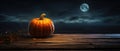 Orange Pumpkin Rests On An Old Wooden Table In Moonlight