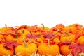 Orange pumpkins with fall leaves on straw hay background isolated over white Royalty Free Stock Photo