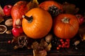 Orange pumpkins, fallen leaves, apples, nuts, berries on wooden background. Concept autumn template, blank halloween or Royalty Free Stock Photo