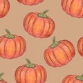 Orange pumpkins isolated on beige background. Seamless pattern. Halloween or Thanksgiving Day decoration. Hand drawn illustration. Royalty Free Stock Photo