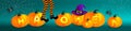 Orange pumpkins with lighting text, purple witch hat and legs with striped stockings on dark green background with cobweb and cute