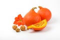 Orange pumpkins with walnuts and hibiscus flower Royalty Free Stock Photo