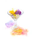 Orange and purple violet flowers float in martini glass with hand painted watercolor blot on white background. Design element,