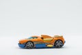 Orange racing toy car on a white background Royalty Free Stock Photo