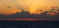 orange rays of the setting sun over the sea horizon Royalty Free Stock Photo