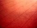 Orange-red background with fabric texture and line striped pattern