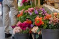 Orange red bouquet of blooming rose flower in front of floral shop in outdoor market. Royalty Free Stock Photo