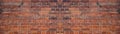 Orange red brown damaged rustic brick wall brickwork stonework masonry texture background banner panorama pattern template Royalty Free Stock Photo