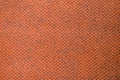 Orange colored fabric swatch samples texture unprinted suiting fabric from above .Cloth texture Royalty Free Stock Photo